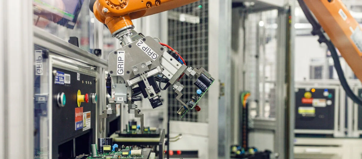autonomous factory robotic arm on PCBA line